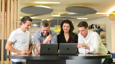 4 RGers working happily in a huddle