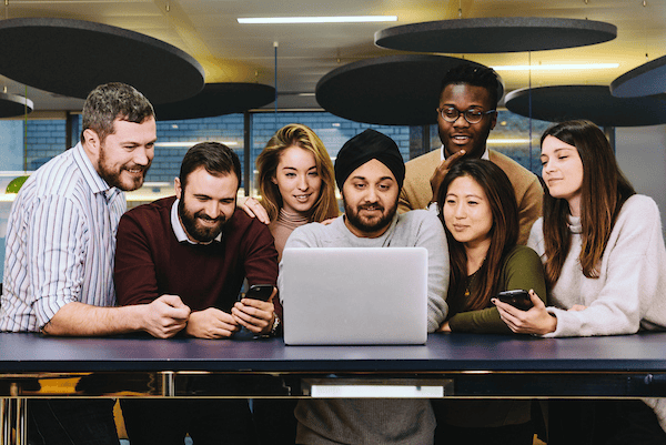 Millennials in a group on laptop (1)