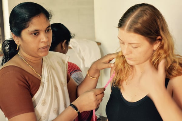 Hannah gets measured by Beena for our first collection in Wayanad